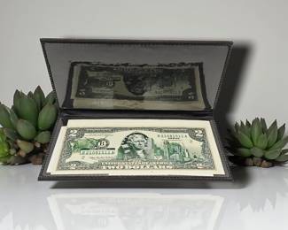 Commemorative United States $2 bills. Uncirculated and in commemorative sleeve. We have multiple of these 