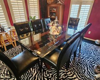 , a-frame glass topped table with wooden A-frame under the beveled glass. All Chairs included  and are noted to be in rough condition 