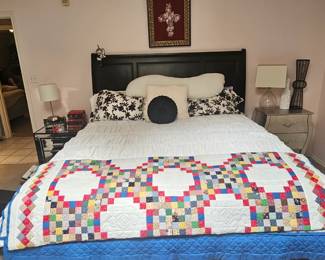 King size bed with mattresses included . King size bed has two drawers at the end with added storage. Betting not included various handmade quilts and bedding sold separately 