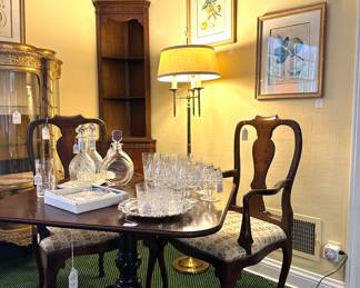 TriPod Pedestal Table and Queen Anne Open-Arm Chairs, Waterford Crystal, Gilt Framed Botanical Prints, Brass Floor Lamp, and Corner Cabinet...