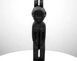 A Unique African Carved Wood Male Tribal Figure With Zoomorphic Creatures