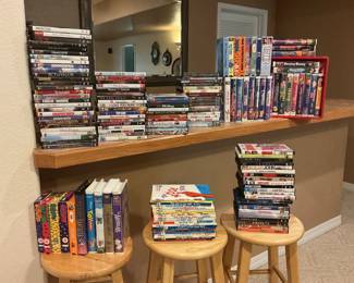 A collection of (100 +/-) DVDs and VHS tapes, (bar stools, mirror