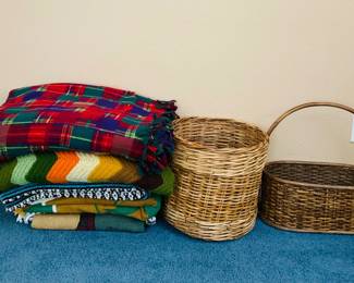 Two (2) wicker baskets, one with handle, and (6) blankets, various sizes.