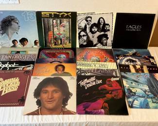 (20 +/-) vintage vinyl records featuring classics such as Toto- self titled, Pat Benatar-