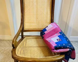 Vintage rocking chair with caning seat and back