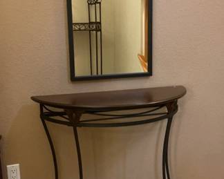 Entry accent table with wrought iron legs and wood/ pressed wood top,