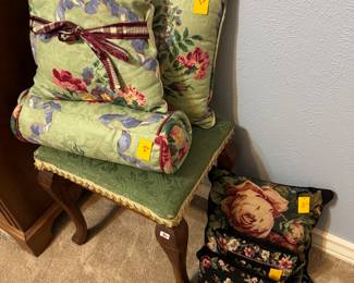 Needlepoint pillows on the floor