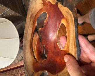 Interesting handmade wooden bowl with knotholes in it