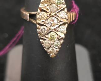 vintage gold and diamond ring missing one stone. has green diamonds 