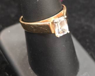 Gold ring with unknown stone.
