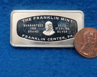 Lot 41. Franklin Mint Bank-marked sterling silver ingot. 65.7 grams.