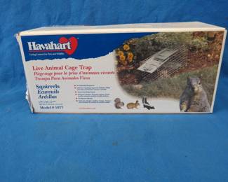 Lot 269. Havahart Model 1077 live trap. 17" x 7" x 7". Also a rat trap.
