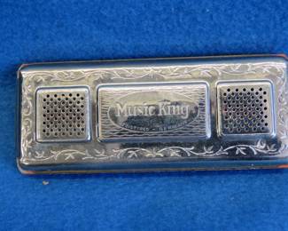 Lot 69. Music King double-sided tremolo harmonica in the key of C. Sounds good.