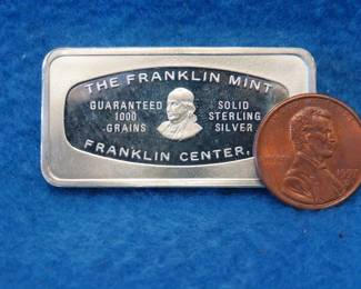Lot 309. Franklin Mint Bank-marked sterling silver ingot. 65.2 grams.