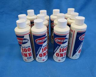 Lot 244. Twelve bottles of Amsoil 2-cycle 100-1 oil