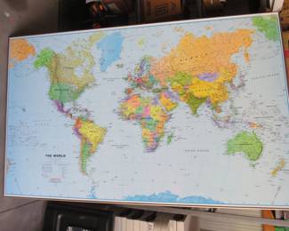 Lot 106. Large 46" x 75" mounted world map on a foam board so pins stick into it. VGC.