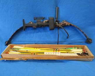 Lot 108. Older RH compound bow, box with a mix of cedar and aluminum arrows, and an ADG hard case. Bow info has been painted over.