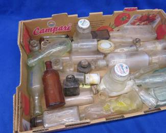 Lot 258. Old glass bottles and jars, some from Watkins