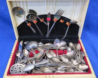Lot 120. Large collection of non-matching flatware in a case, some is marked Rogers and silverplate