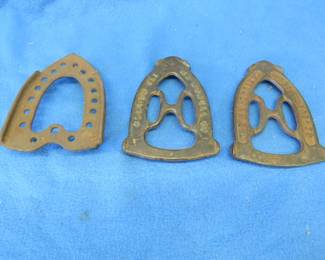 Lot 361. Three antique iron trivets