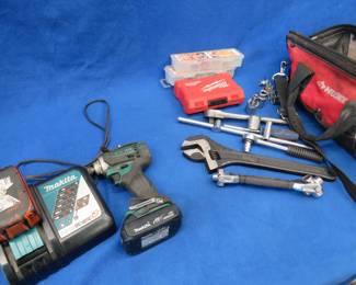 Lot 90. Lots of tools, including a Makita 18v impact driver with two lithium-ion batteries and charger in working condition. Ratchets, sockets, and more.