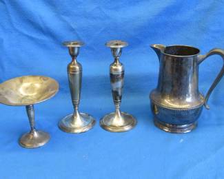 Lot 204. Two engraved sterling-weighted candlestick holders, a silverplate compote, and a water pitcher
