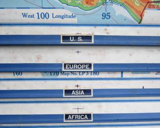 Lot 299. 1954 roll-up maps. Maps show the US, Europe, Asia, Africa, N. America, S. America, the World, and--strangely--Wisconsin. Open/Lock is not working.