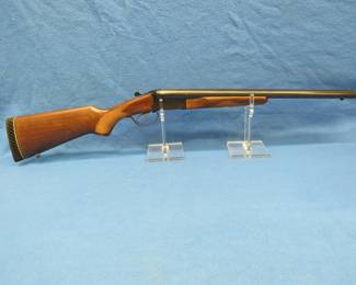 Lot 374. Stoeger 12-gauge side x side Coachgun. NSN. Both 20" barrels have a 3" chamber. Made by E.R. Amantino in Brazil. Two snap caps and a cloth case.