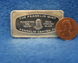 Lot 45. Franklin Mint Bank-marked sterling silver ingot. 65.0 grams.