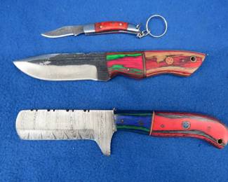 Lot 223. Two fixed-blade knives with leather sheaths, one is Damascus, and one small Damascus folder