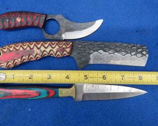 Lot 225. Three fixed-blade knives with leather sheaths, one is Damascus