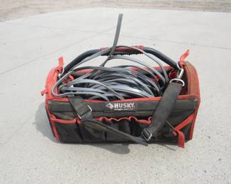 Lot 303. Husky tool bag with underground 12-2 plus ground electrical wire. Too much to stretch out and measure.
