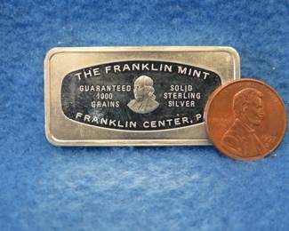 Lot 306. Franklin Mint Bank-marked sterling silver ingot. 65.5.