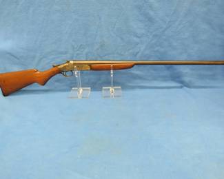 Lot 21. Iver Johnson single shot 12-gauge break-action shotgun. Ser. # 555857XH. Very good condition. Includes case.