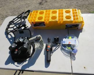 Lot 72. Binoculars, Reebok shoe inflator, camper levelers, Harley Davidson luggage rack, and more