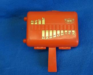 Lot 65. Emenee plastic roll Harmonica, missing 2 handles