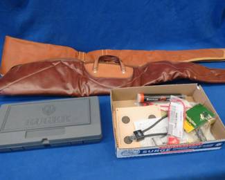 Lot 165. Two soft long-gun cases, a plastic Ruger 44 mag pistol box, gun locks, and more