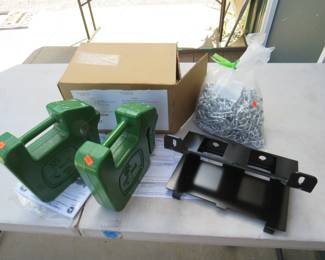 Lot 73. Two 42-Lb. John Deere frame weights, frame mounting bracket, and tire chains