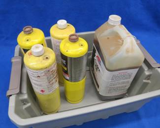 Lot 243. Four bottles of MAP gas and approx. 1-Gallon of AmsOil 10W-40 engine oil