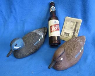 Lot 262. Two plastic decoys, a Schlitz flashlight, and postcards