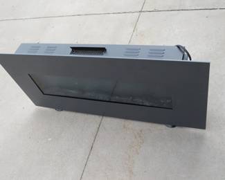 Lot 399. Electric fireplace. Owner said it works. 48" W x 22.5" H x 5.5"D