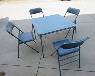 Lot 313. Card table with 4 matching chairs. One chair has taped wear.