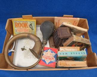 Lot 217. Vintage books, games, an old brass squeeze bulb horn, and more