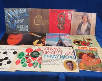 Lot 428. 12 LPs including Elton John, Chicago, Toto, Springsteen, Phil Collins, Steve Miller and more.