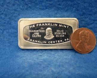 Lot 43. Franklin Mint Bank-marked sterling silver ingot. 65.3 grams.