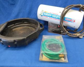 Lot 360. 50,000 BTU torpedo-style Reddy Heater, oil drain pan, and a suction hose