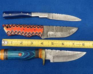 Lot 227. Two fixed-blade knives and one folder with leather sheaths made of Damascus