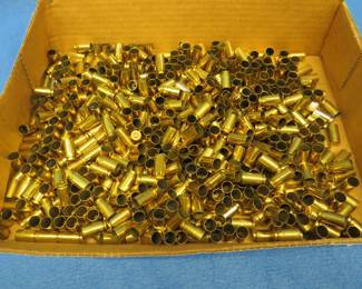 Lot 406. 40 S & W brass for reloading. Some with spent primers some with no primers.