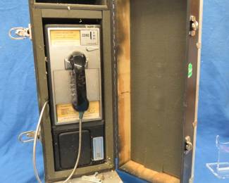 Lot 369. Salesman's sample metal payphone in a rolling case.