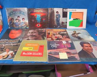 Lot 130. 12 LPs including The Beatles, Boston, Billy Joel, Genesis, Phil Collins, Jim Croce, and more